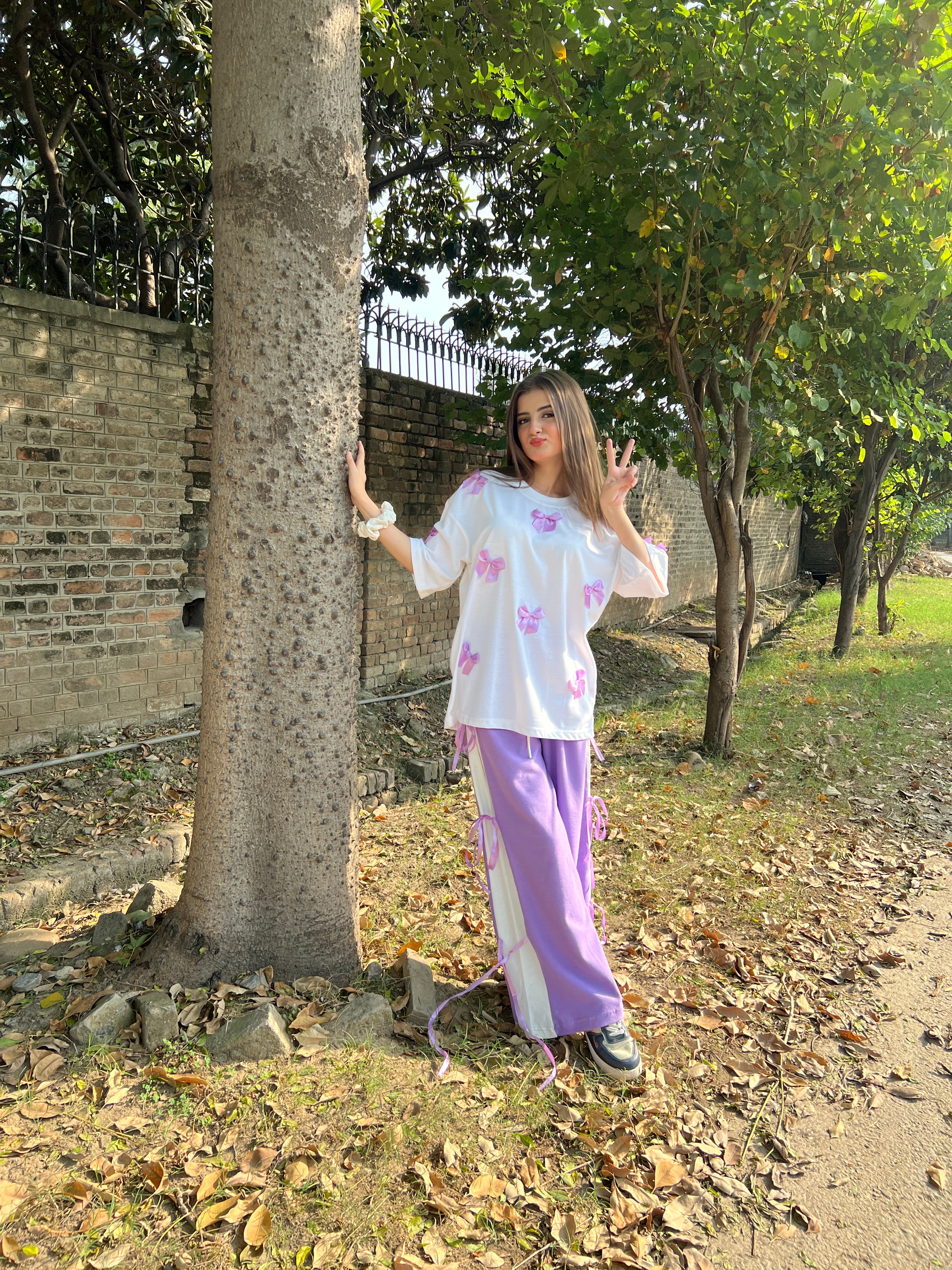 Bow All Over Drop Shoulder Tee Paired with Contrast Ribbon Wide-Leg Trousers - Lilac