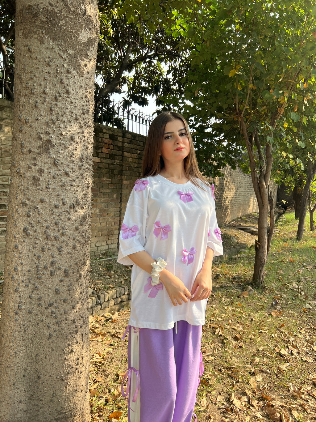 Bow All Over Drop Shoulder Tee Paired with Contrast Ribbon Wide-Leg Trousers - Lilac