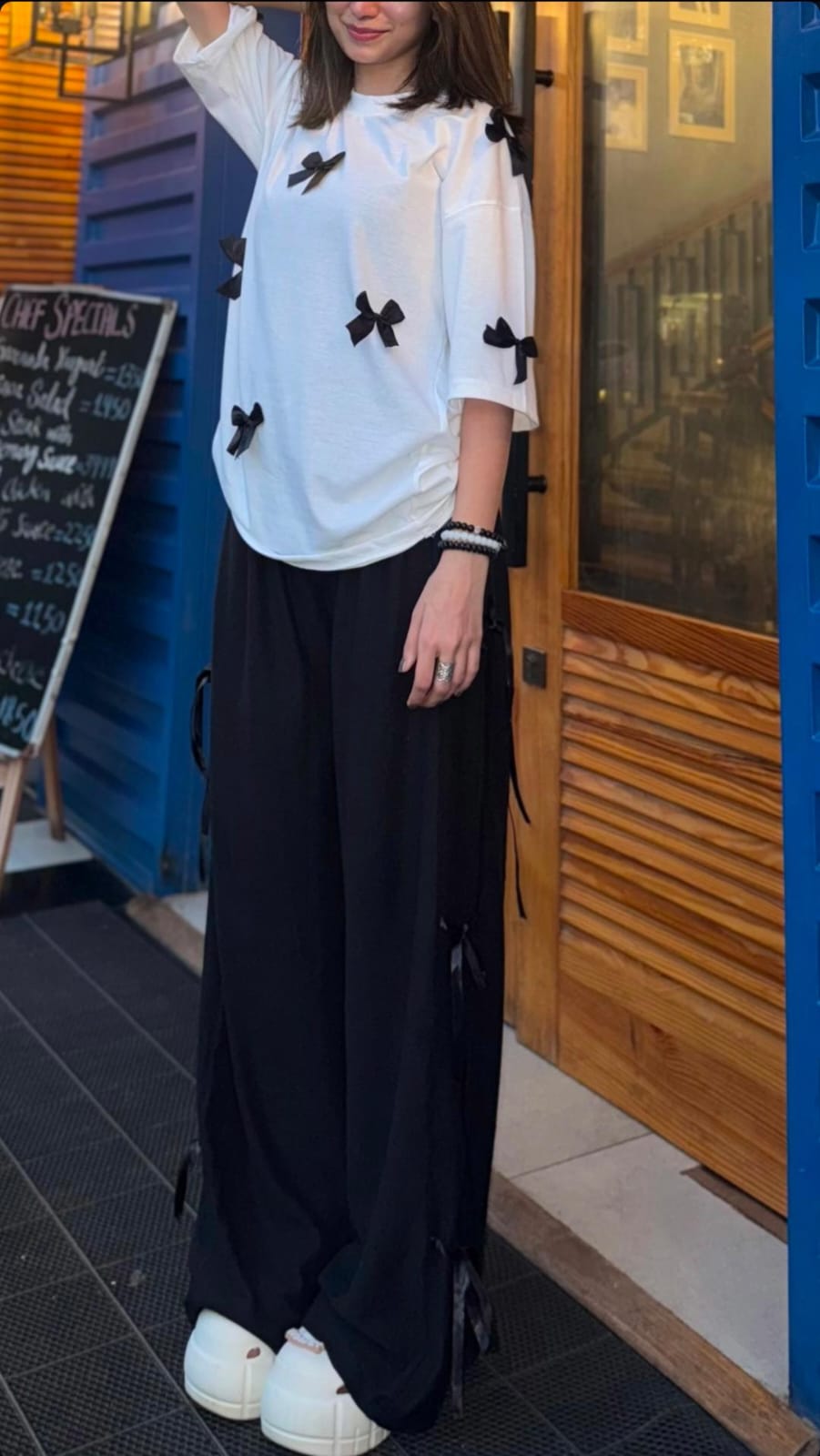 Bow All Over Drop Shoulder Tee Paired with Ribbon-Tied Wide-Leg Trousers